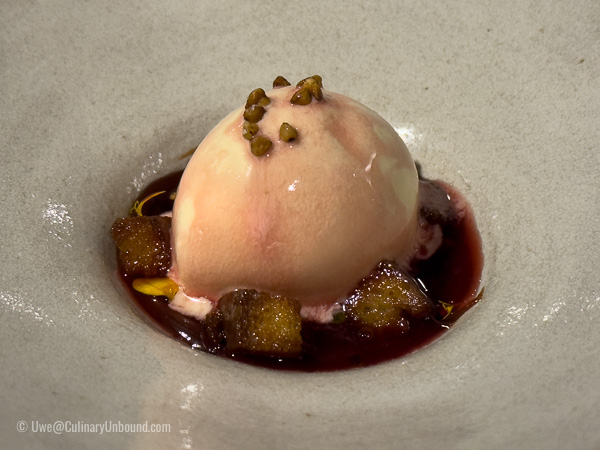 Buckwheat ice cream with salted plums, grilled pear, and lemon tagetes