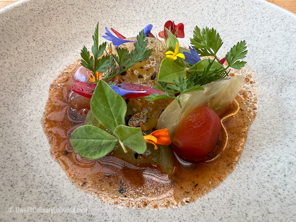 Tomato ceviche with soy sauce, chili, sesame and wild flowers